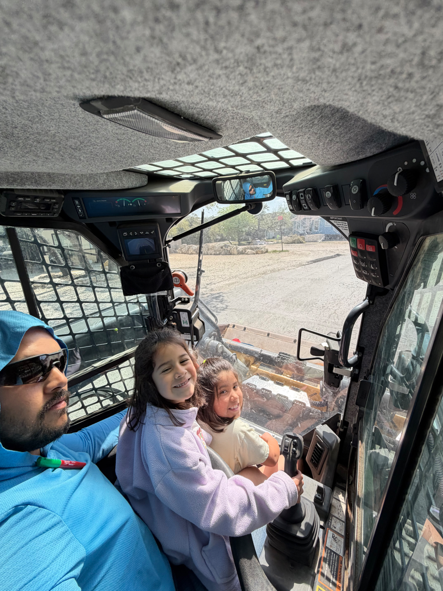 Owner of Duck Decks and More in the skid steer