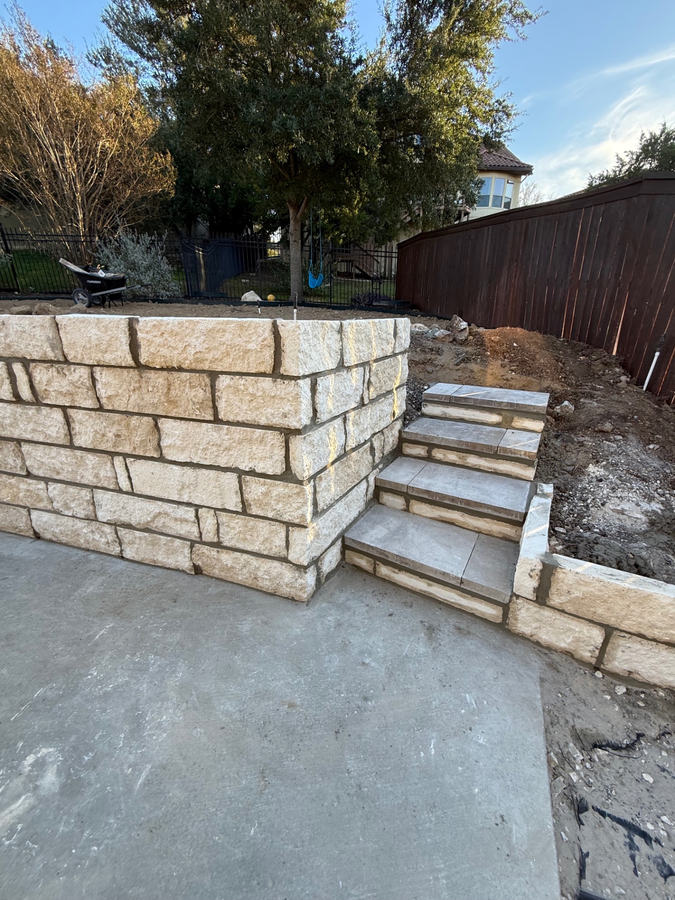 Limestone wall with tile step risers